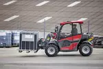Weidemann T4512e telehandler with pallet fork in use on a farm