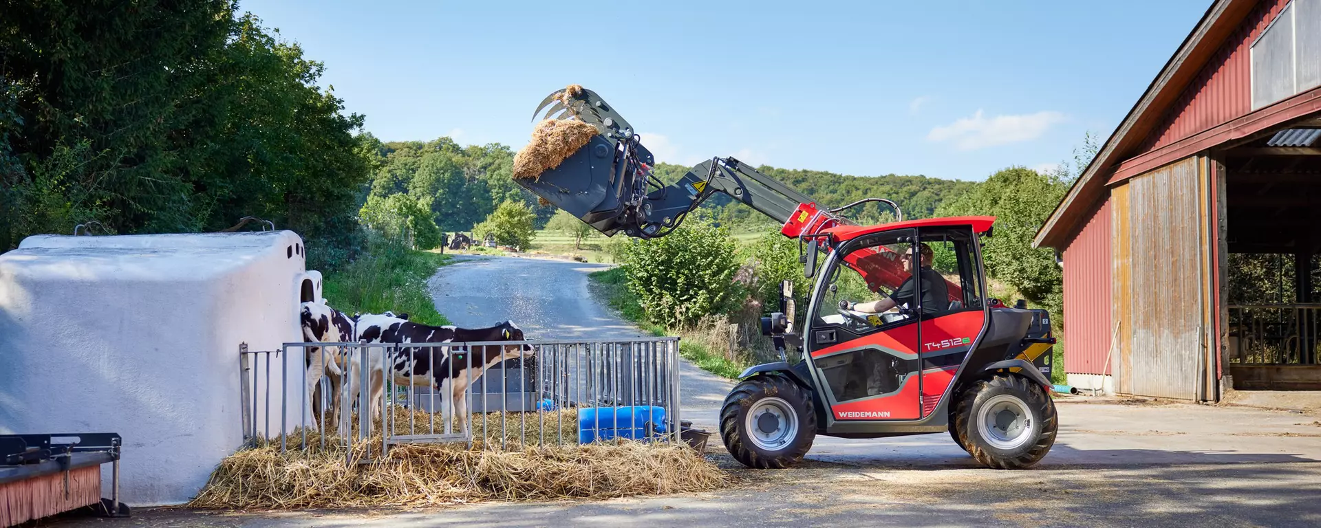 Weidemann T4512e telescopic handler in operation on a farm