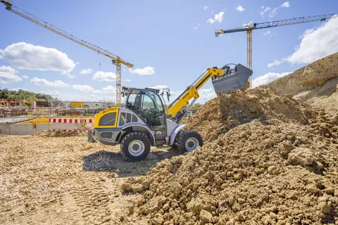The Kramer telescopic wheel loader 8095T while working with soil.