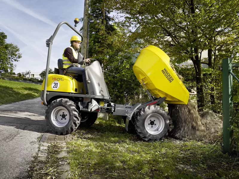1501s wheel dumper unloading earth in the field