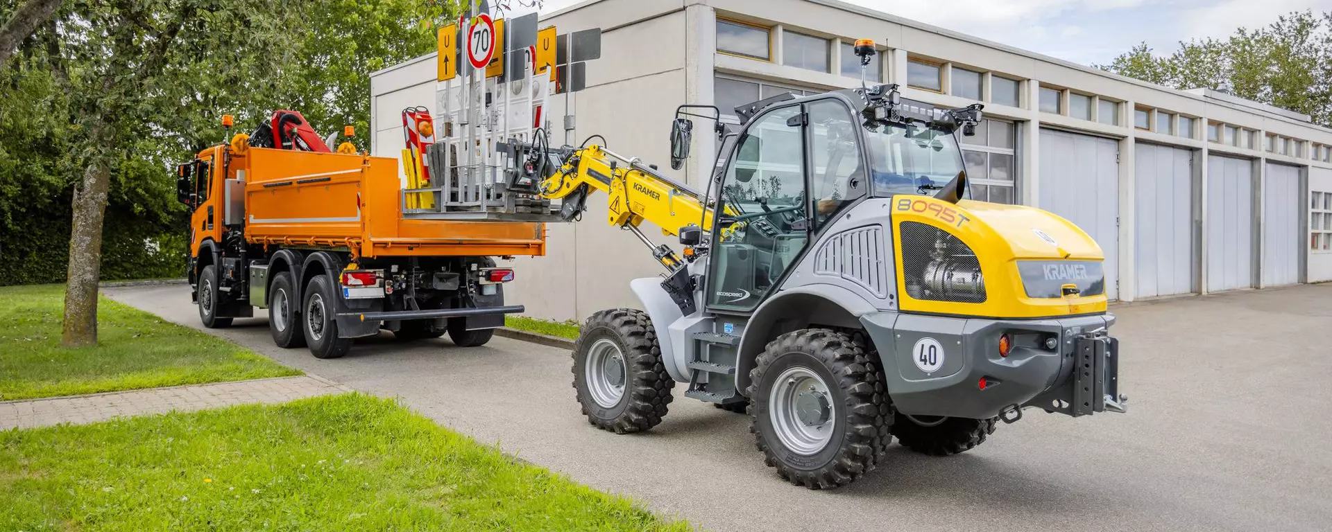 The Kramer telescopic wheel loader 8095T while loading traffic signs.