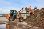 Weidemann attachment Rotary sweeper 25, in action municipality, Hoftrac 1260LP