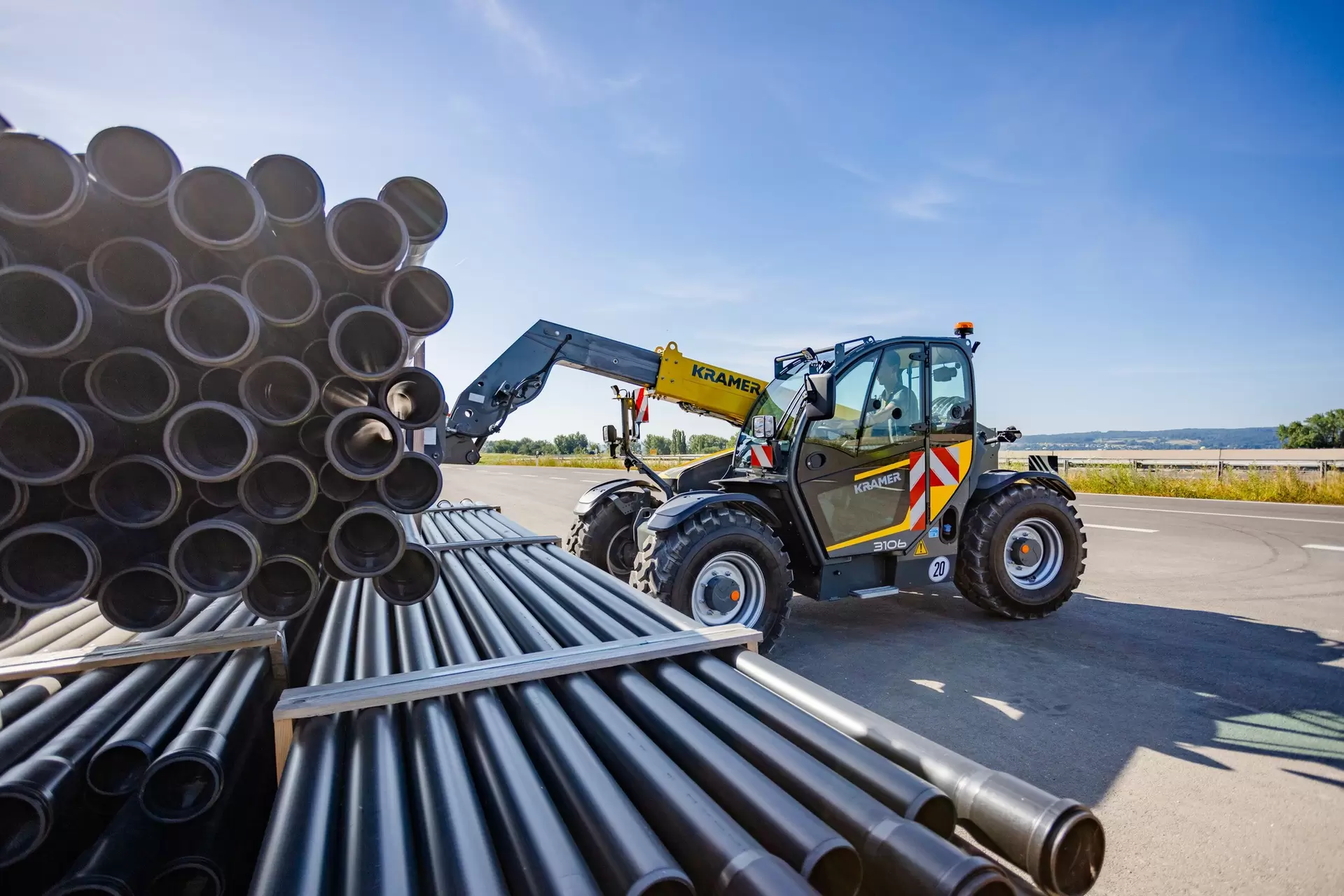The Kramer Telehandler 3106 loading material.