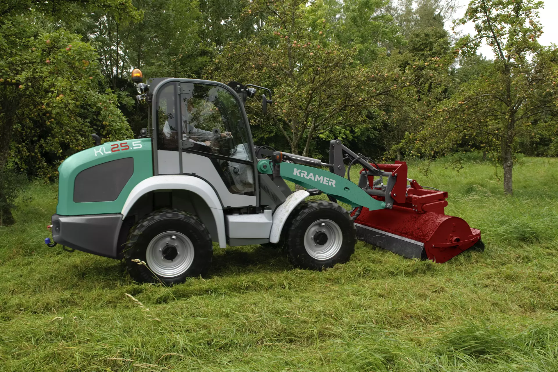 The Kramer wheel loader KL25.5 while mowing grass. 