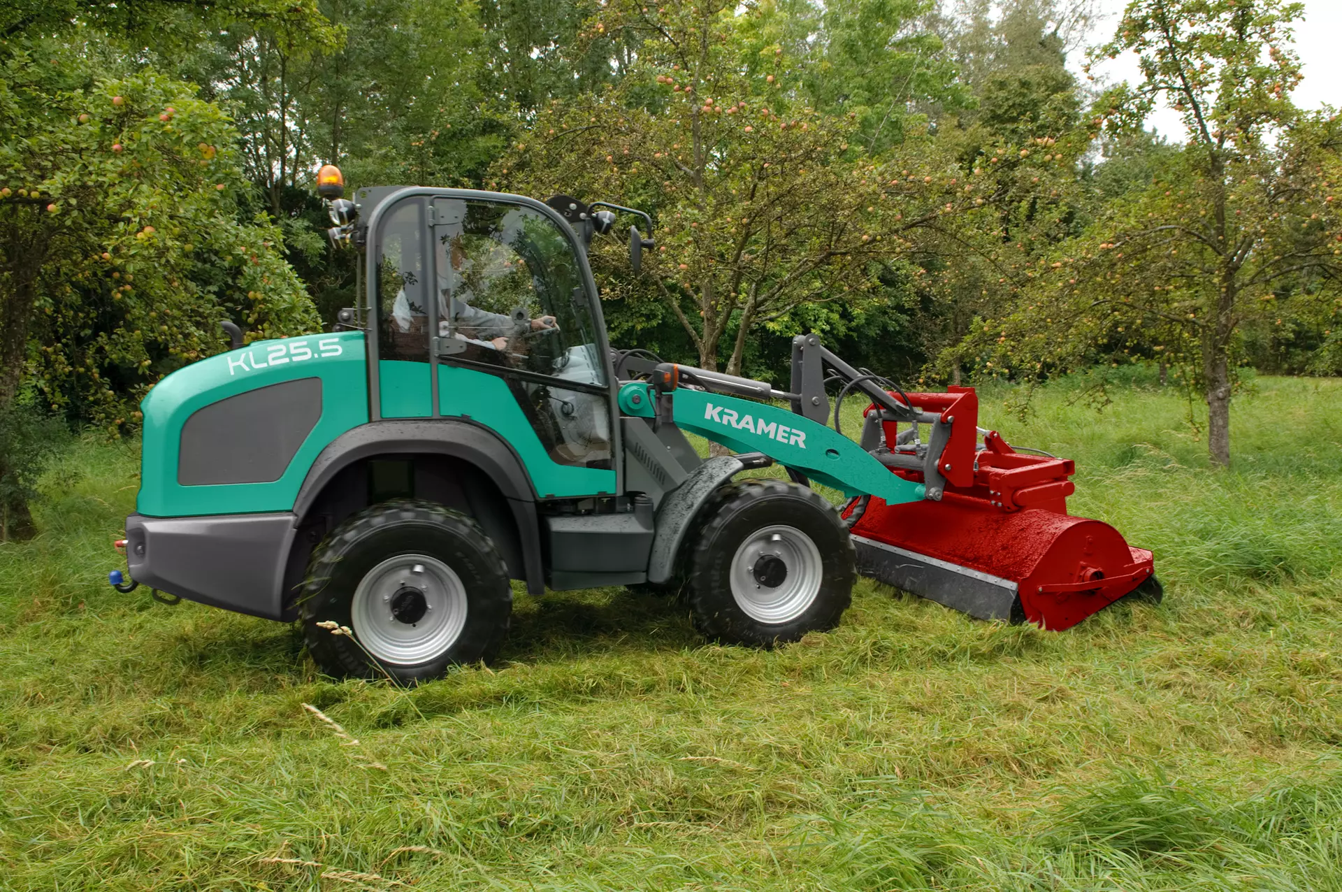 The Kramer wheel loader KL25.5 while mowing grass. 