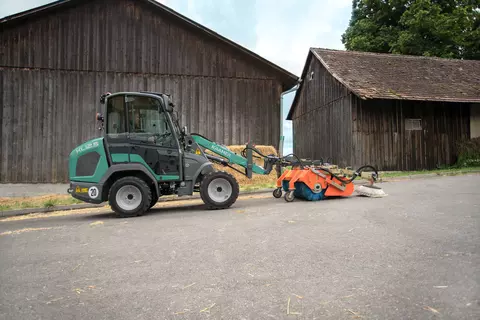 The compact KL12.5 while brushing a yard.