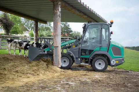 The compact KL12.5 while loading dung. 