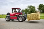 Weidemann telehandler T4512e with bale spike on an agricultural farm
