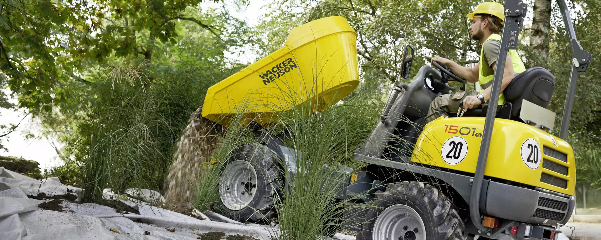 1501s wheel dumper tips stones onto a weed tile when redesigning a garden area