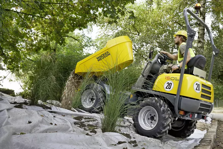 1501s wheel dumper tips stones onto a weed tile when redesigning a garden area