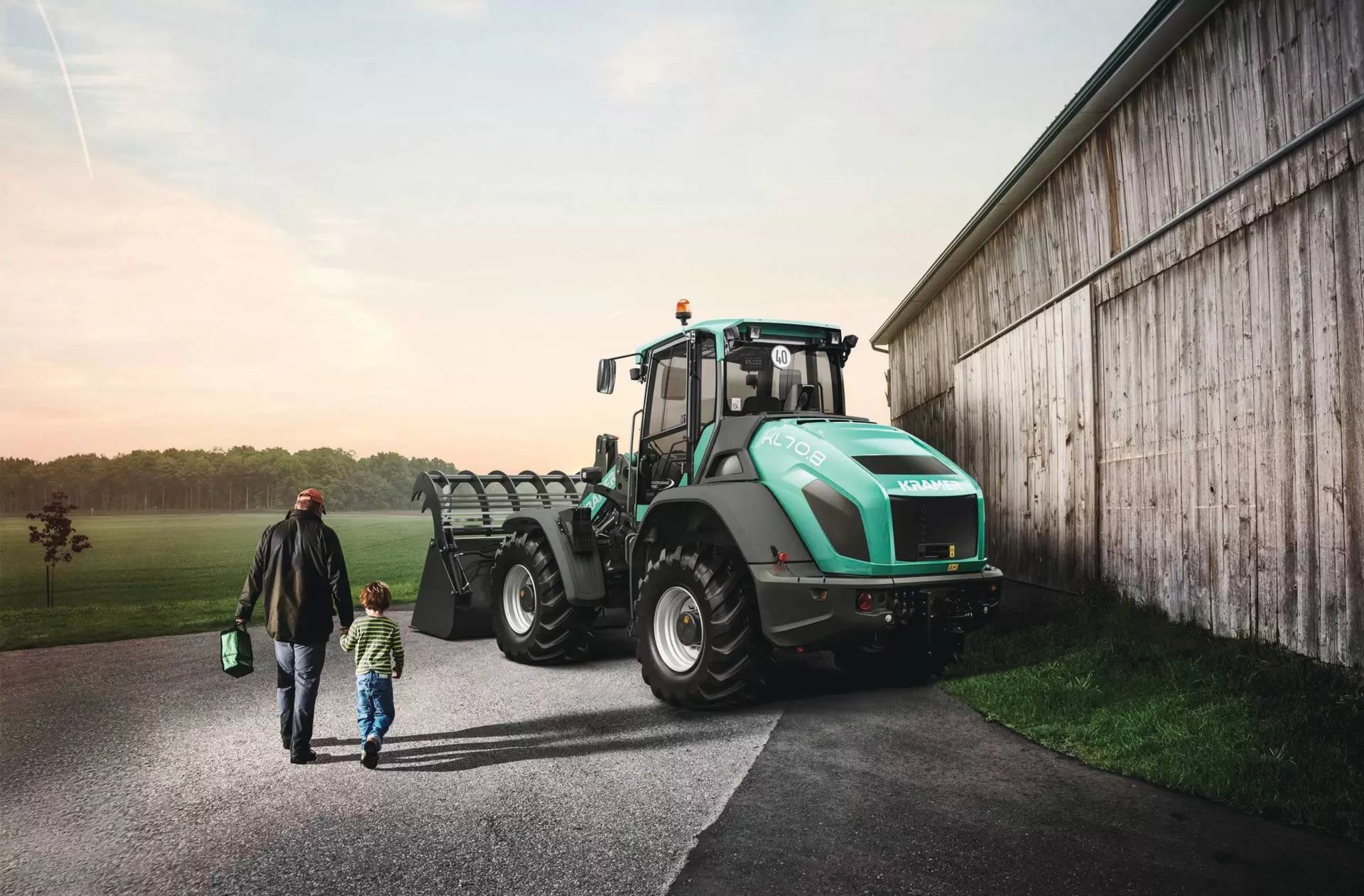 The Kramer wheel loader KL70.8 and KL70.8L while working on a farm.