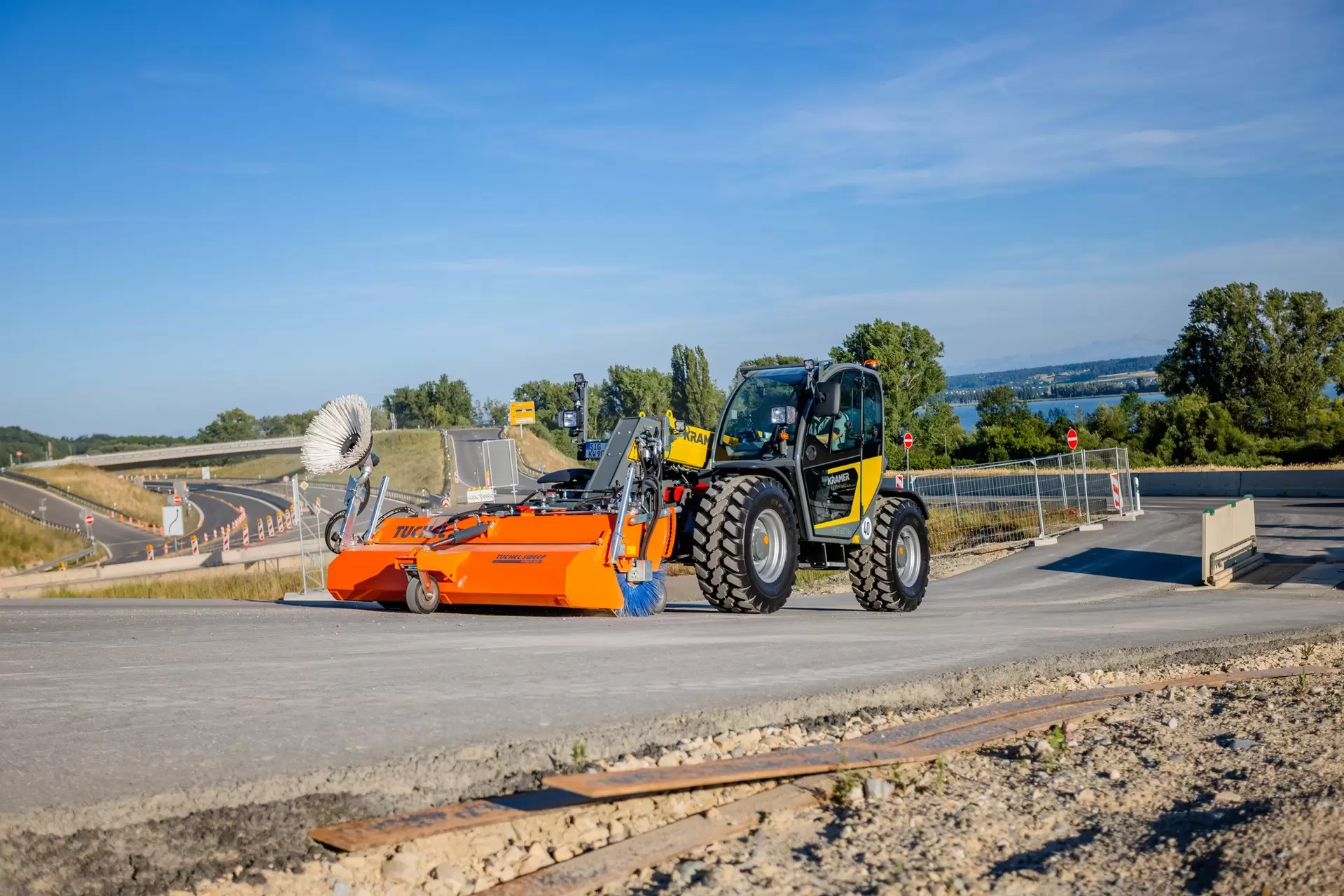 The Kramer telehandler on the move with the bucket brush.