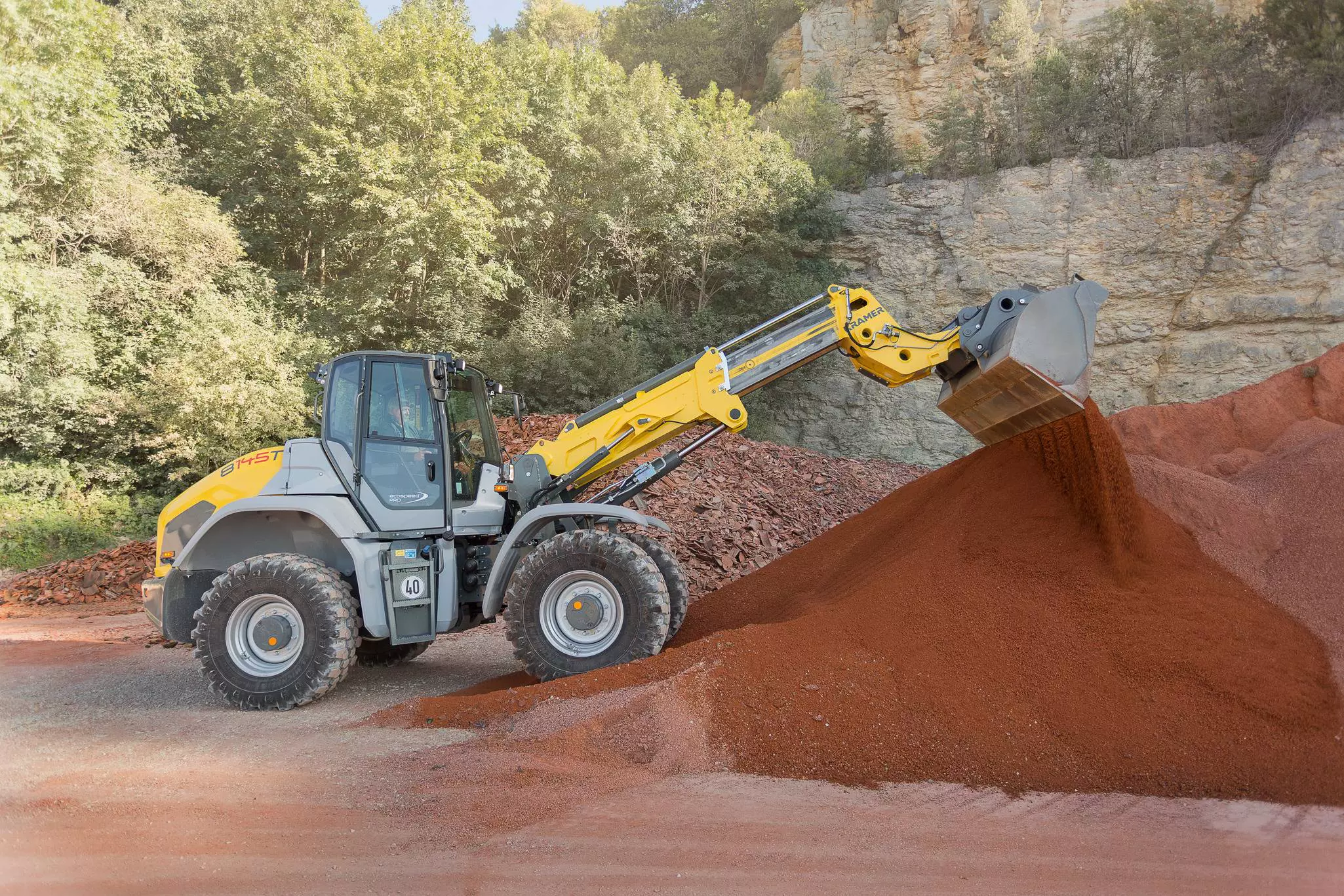 The Kramer telescopic wheel loader 8145T while loading sand.