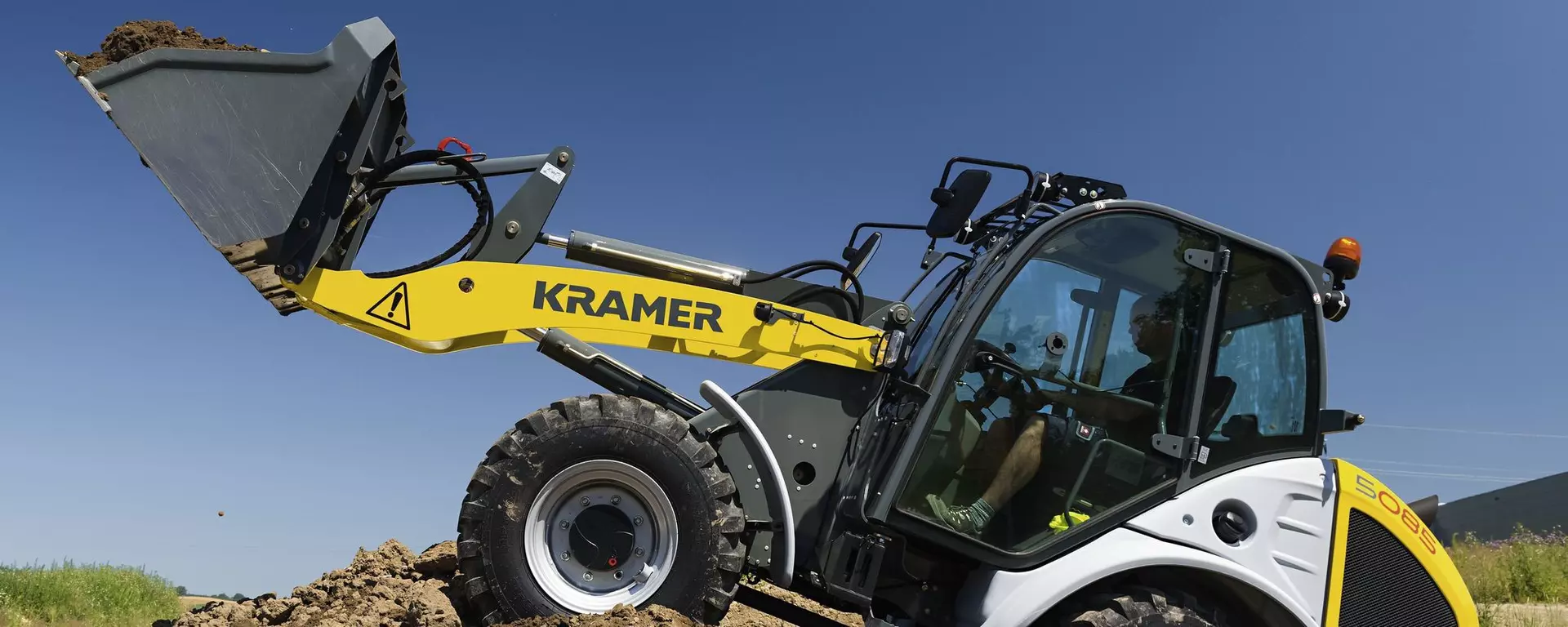 	
The Kramer wheel loader 5085 while working with soil.