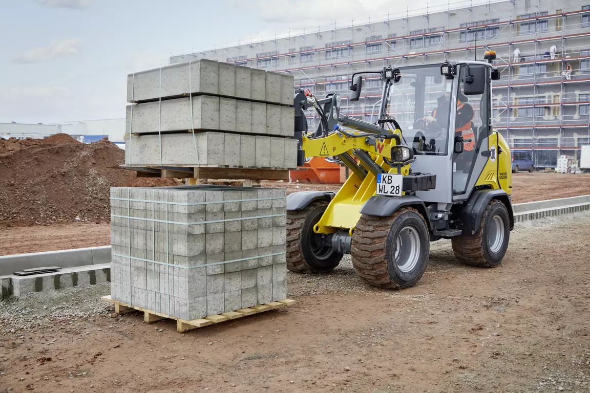 Wacker Neuson wheel loader WL28, cabin, action picture with pallet fork