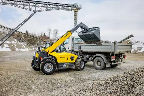 The Kramer 3106 telehandler unloading gravel.