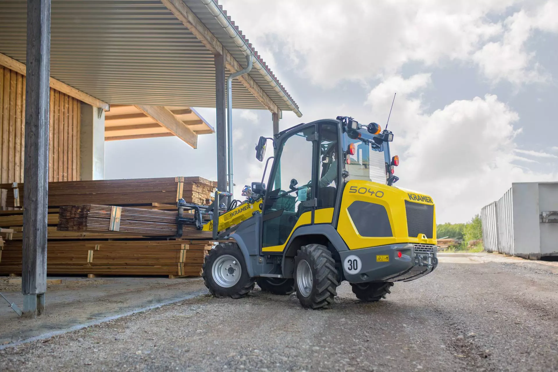 The compact 5040 while transporting wood. 