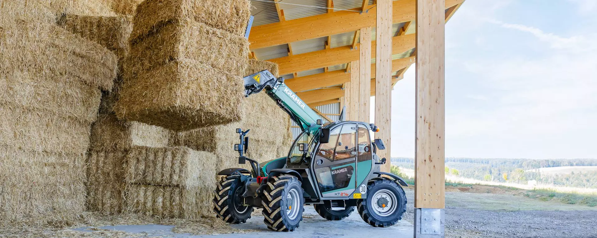 The Kramer telehandler KT276 while stacking straw. 
