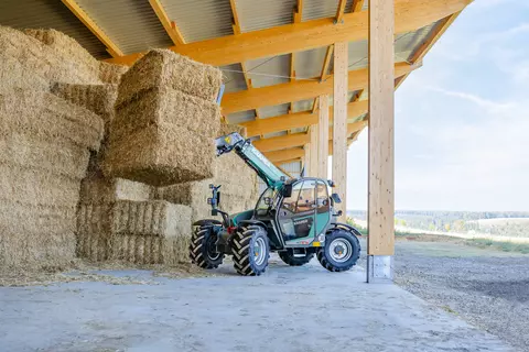 The Kramer telehandler KT276 while stacking straw. 