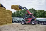 Weidemann telehandler T4512e with bale spike on an agricultural farm