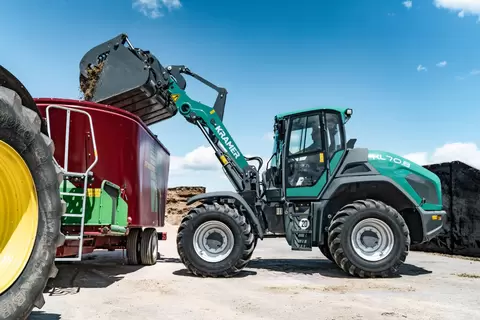 The Kramer wheel loader KL70.8 and KL70.8L while working on a farm.