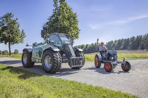 KT457 on road trip with the old Kramer tractor. 