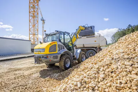 The Kramer telescopic wheel loader 8095T while loading stones.