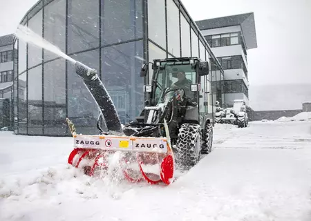 The Kramer wheel loader KL14.5 while clearing snow from driveways.