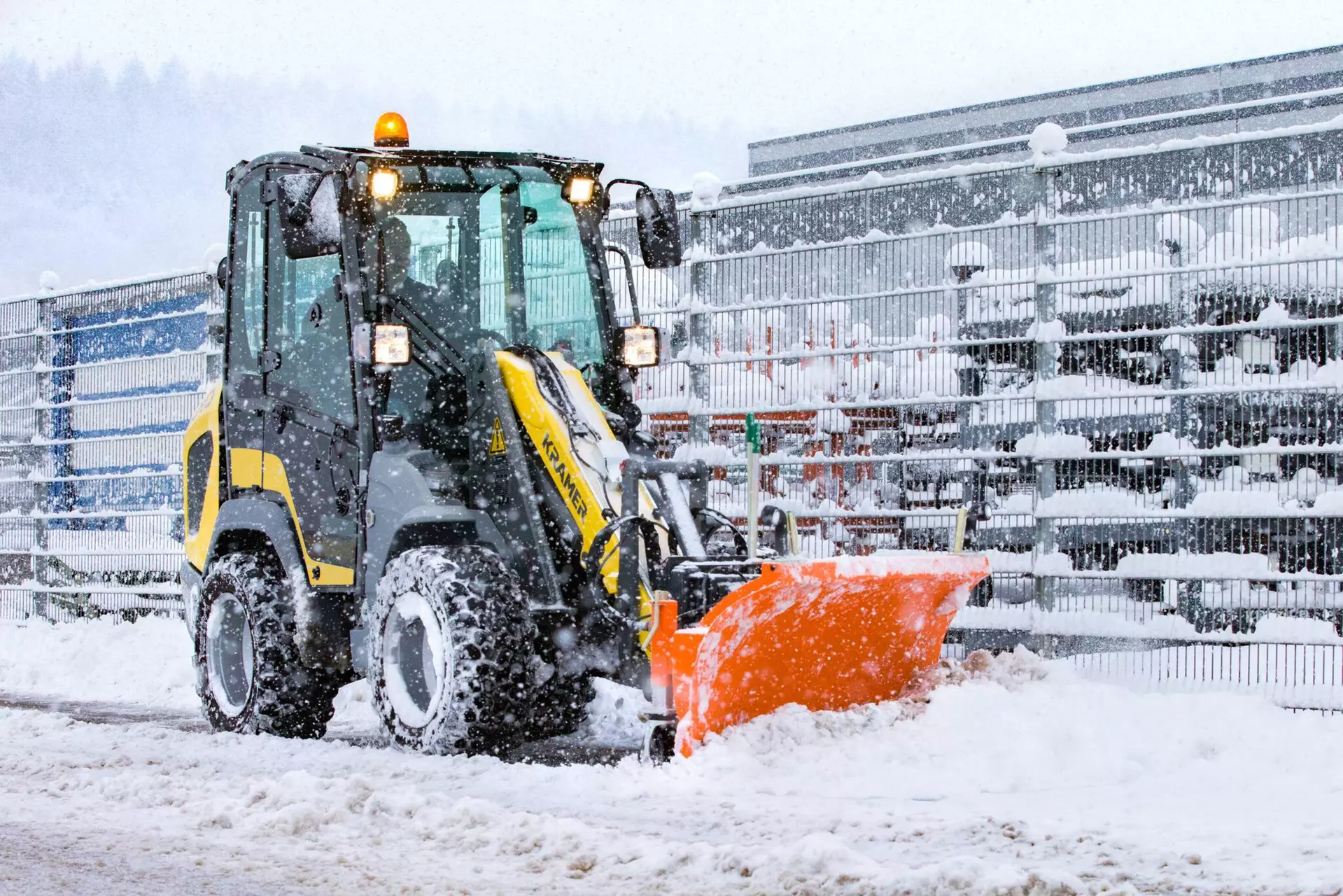 The Kramer wheel loader 5040 while pushing snow.