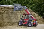 Weidemann T4512e telehandler with grippinb bucket in use on a farm