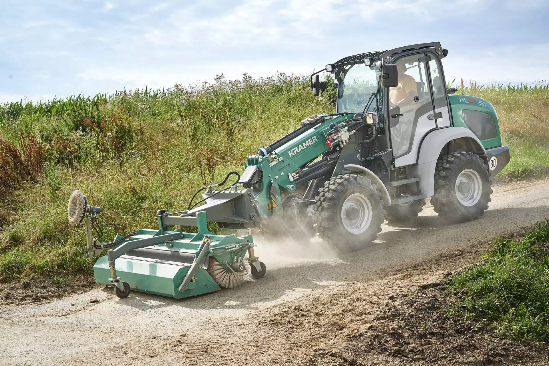 The Kramer telescopic wheel loader KL25.5T while cleaning a street. 