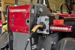 Weidemann telehandler T4512e during loading process on an agricultural farm